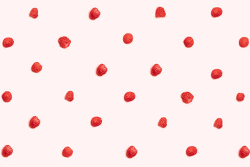 Pattern of ripe raspberries on a pink background. Can be used for blog, poster or web banner.