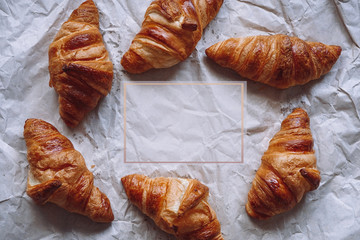 Croissants and place for text on kraft paper background 