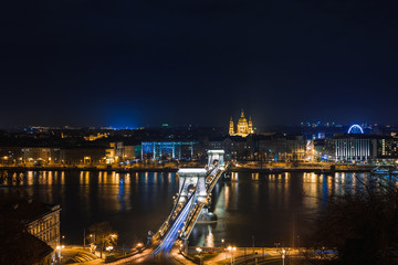 Night view of Budapest. Panorama cityscape of famous tourist destination with Danube and bridges. Travel illuminated landscape in Hungary, Europe.