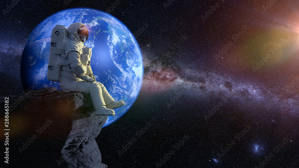 Canvas Prints astronaut sitting on a cliff on the moon in front of planet earth