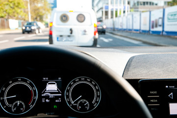 Car with adaptive cruise control (ACC) following and stopping behind another one