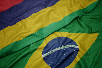 waving colorful flag of brazil and national flag of mauritius.