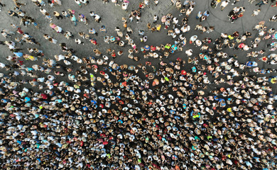 Fototapeta premium Aerial. People crowd on a city square background. Top view.