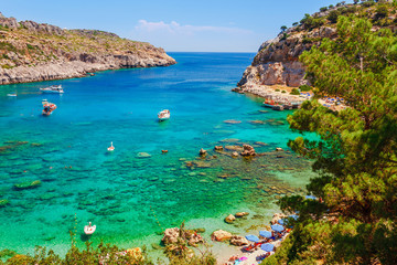 Sea skyview landscape photo Anthony Quinn bay near Ladiko bay on Rhodes island, Dodecanese, Greece. Panorama with nice sand beach and clear blue water. Famous tourist destination in South Europe