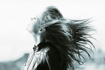 Fototapeta premium Wind hair hairstyle hair styling girl adult spring