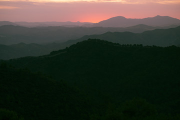 Mountains in black with pink sky