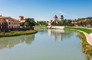 Naklejka na ściany i meble Panoramic cityscape aerial view on Verona historical center, bridge and Adige river. Famous travel destination in Italy. Old town where lived Romeo and Juliet from Shakespeare story