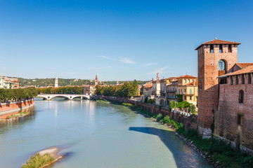 Obraz premium Panoramic cityscape aerial view on Verona historical center, bridge and Adige river. Famous travel destination in Italy. Old town where lived Romeo and Juliet from Shakespeare story