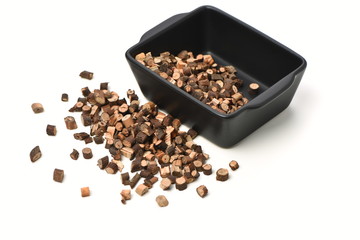 Cinnamon twig chinese herbal medicine on a white background pestle over white background. Gui zhi.