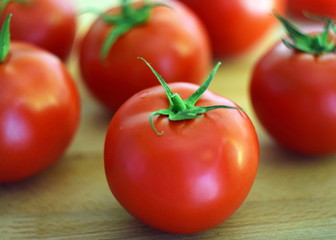 tomatoes on wooden background