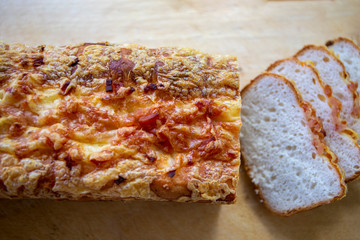 Loaf of Bread on bacon, garlic and cheese