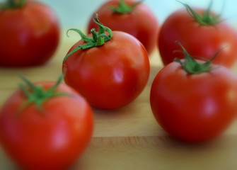 tomatoes on wooden background