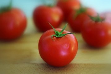 tomatoes on wooden table