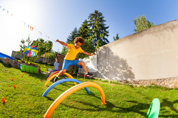 Competitive active game - boy jump over obstacles