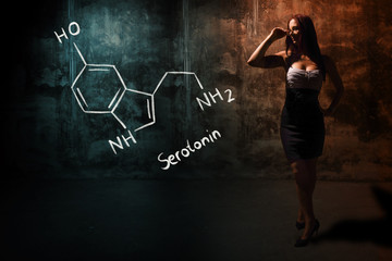 Sexy girl or secretary or female student presenting handdrawn chemical formula of serotonin