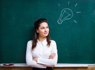 young teacher comes up with an idea near the board