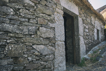 Fototapeta na wymiar Street of old mediterranean town with stone house. Galicia Spain.