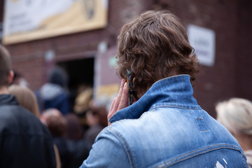 man talking on a mobile phone on a city street