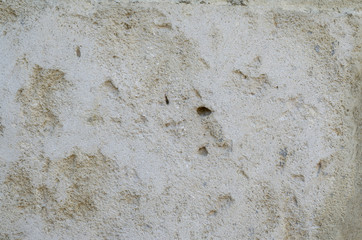 white and yellow stone wall of the historic 1700 - 1800 g close-up texture