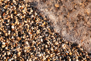 Pebbles in the beach, abstract outdoor background