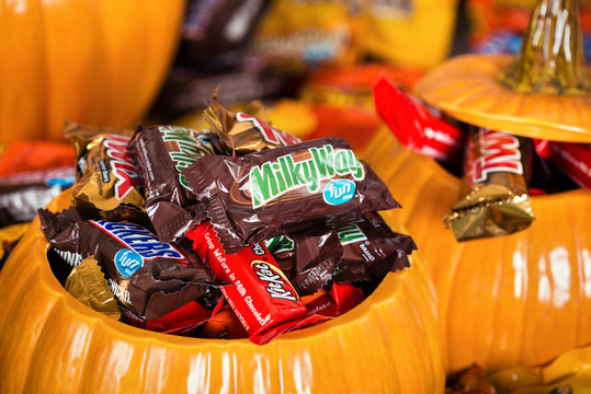 Decorative pumpkins filled with assorted Halloween chocolate candy made by Mars, Incorporated and the Hershey Company on October 31, 2015 in Dallas, Texas