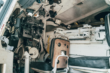Inside military combat vehicle, gunner's seat with seat and instruments