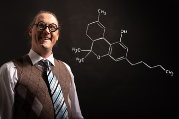 Professor presenting handdrawn chemical formula of THC