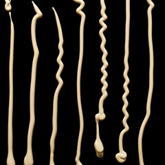 Foundation cream spots set on black background close up