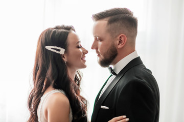 close up. happy bride and groom looking at each other