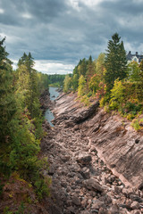 Stone canyon and castle on the Vuoksa River, in the city of Imatra in Finland, nature reserve in autumn