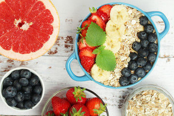 Healthy diet breakfast including cereal with berry and fruits