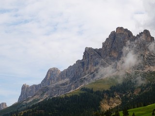 The "Roda di Vael", one of the peaks of the Dolomites of the Catinaccio / Rosengarten massif seen from the woods of Trentino, near the village of Carenzza, Italy - August 2019.