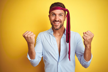 Hangover business man drunk and crazy for hangover wearing tie on head celebrating surprised and...