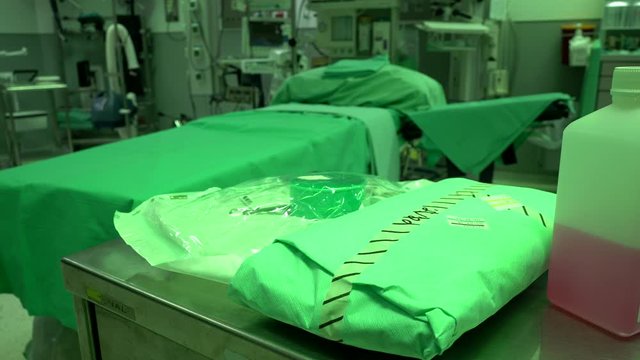 Orthopedic surgery. Hospital. Operating room.Professor, doctor, nurses, surgeon. During a medical operation. In sterile green suits. 