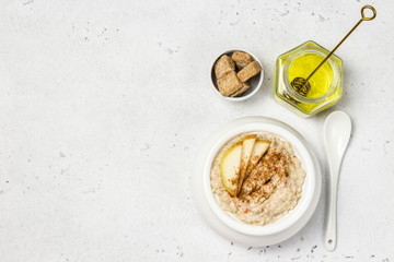 Fototapeta premium Spiced cinnamon apple pie porridge. Top view, space for text.