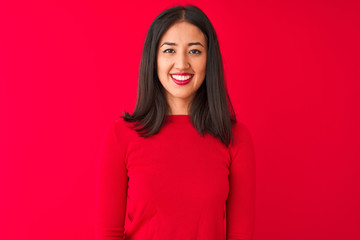 Fototapeta premium Young beautiful chinese woman wearing casual dress standing over isolated red background with a happy and cool smile on face. Lucky person.