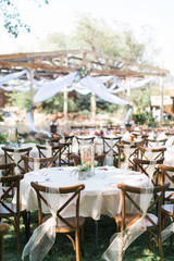 Chairs and table at outdoor summer wedding, wedding reception decor, ceremony
