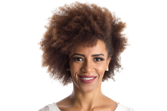 african american woman looking happily in camera. Standing against white background.