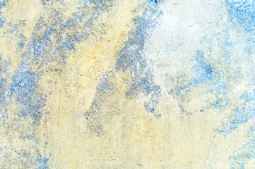 Abstract background. Damaged wall with traces of destruction. Rough and uneven surface of an old building.