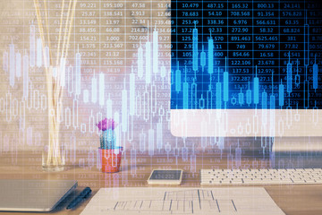 Financial chart drawing and table with computer on background. Double exposure. Concept of international markets.