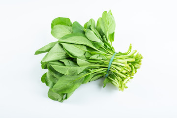 Obraz premium a handful of fresh green cabbage on a white background