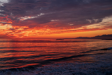 Fototapeta na wymiar Dramatic sunset over the Pacific ocean