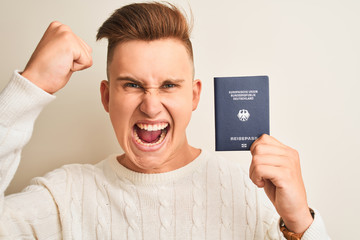 Young handsome man holding Germany German passport over isolated white background annoyed and...