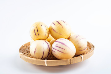 Fresh fruit ginseng fruit on a bamboo plate on white background