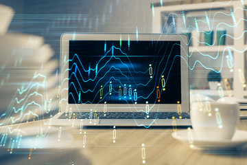 Forex market chart hologram and personal computer background. Multi exposure. Concept of investment.