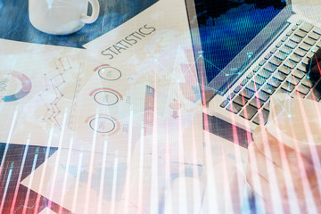 Double exposure of man's hands writing notes of stock market with forex graph background. Concept...