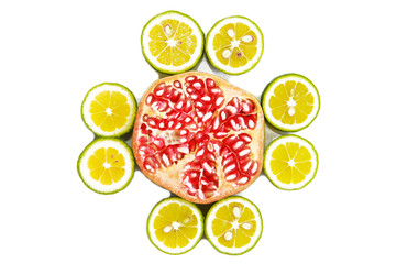 slices of red natural pomegranate and slices of yellow lime lemon