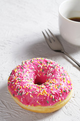 Pink donuts with coffee