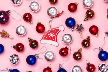 New Year Christmas Creative Background with Red and Silver Brown Christmas Balls on Pink Background Christmas Flat Lay Top View Festive Holiday Card or Background Pattern