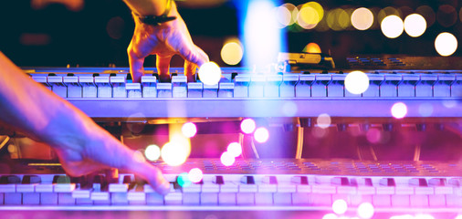 Live music and music festival background.Instrument on stage and band.Stage lights.Abstract musical background.Playing piano and concert concept.